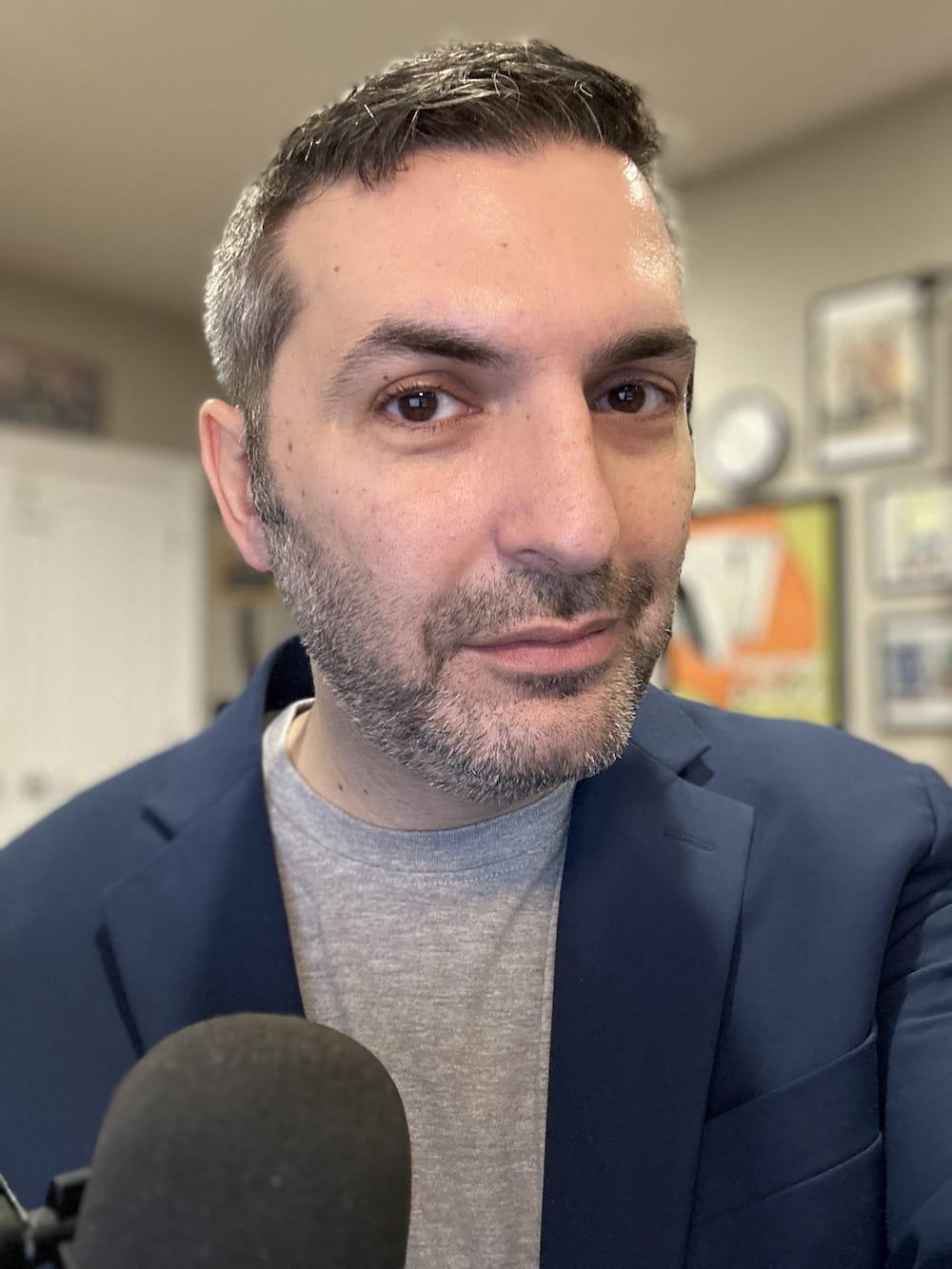 Lex Friedman in a blazer in front of a microphone