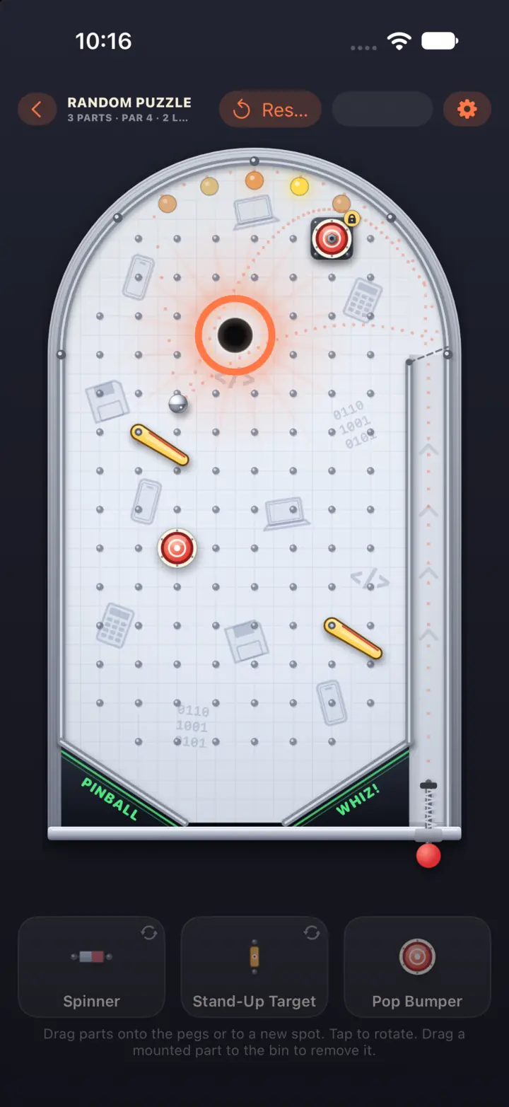 An office-themed machine on graph paper with two flippers mounted on the pegs and a dotted line tracing the ball’s path (iPhone)